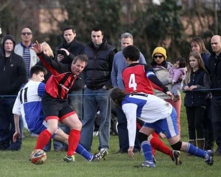 Stuart Peace is tackled by a Wotton Rovers during Longford AFC defeat in 2016.